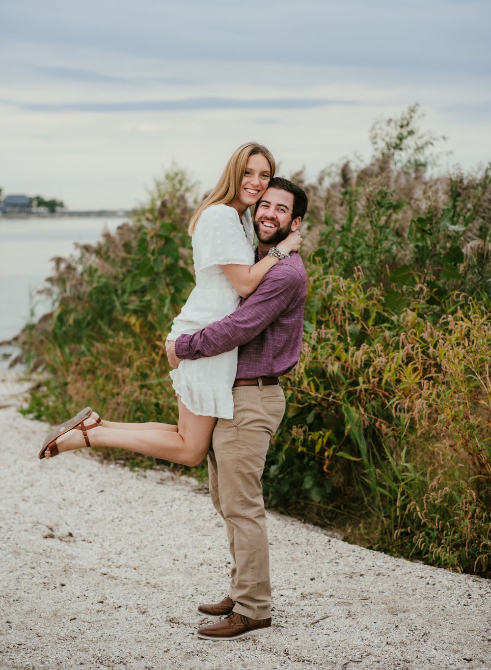 embracing couple on beach