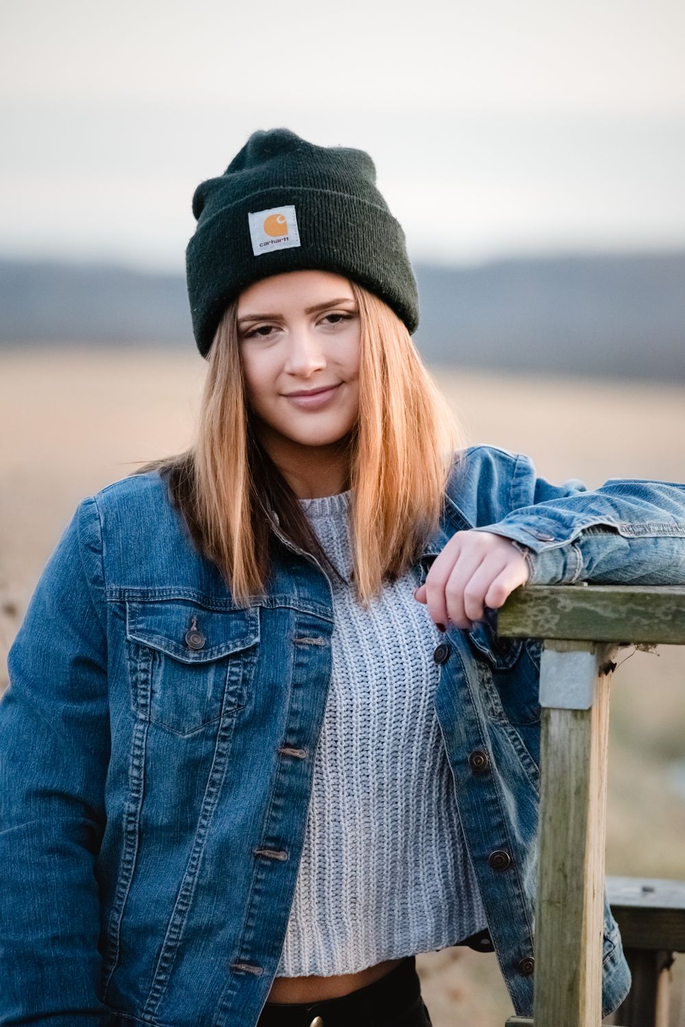 senior girl open field jean jacket carhartt hat