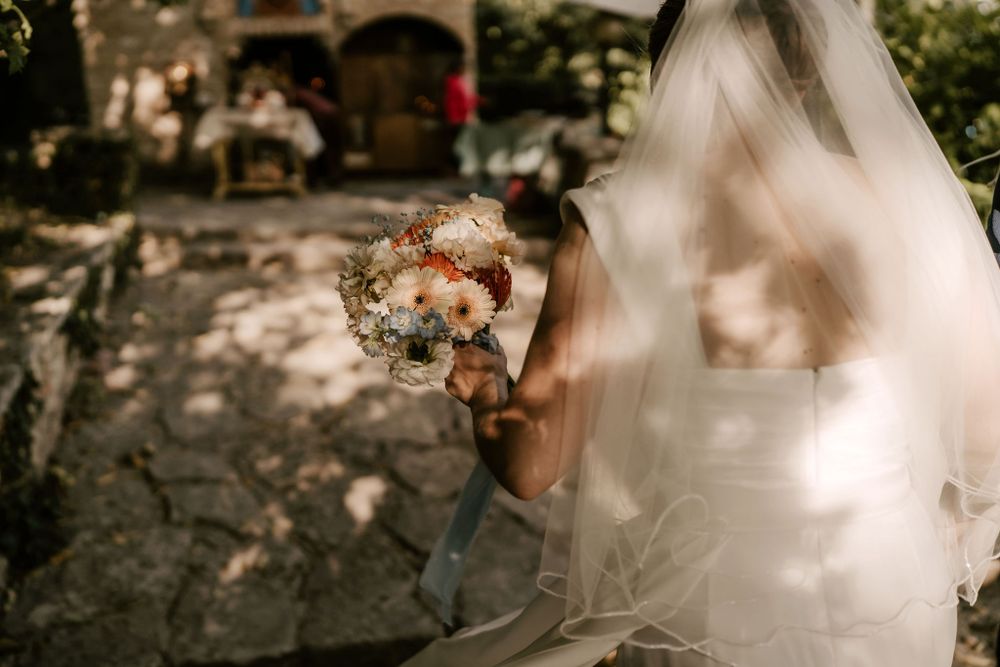 A romantic wedding moment captured through delicate lace details and soft lighting.