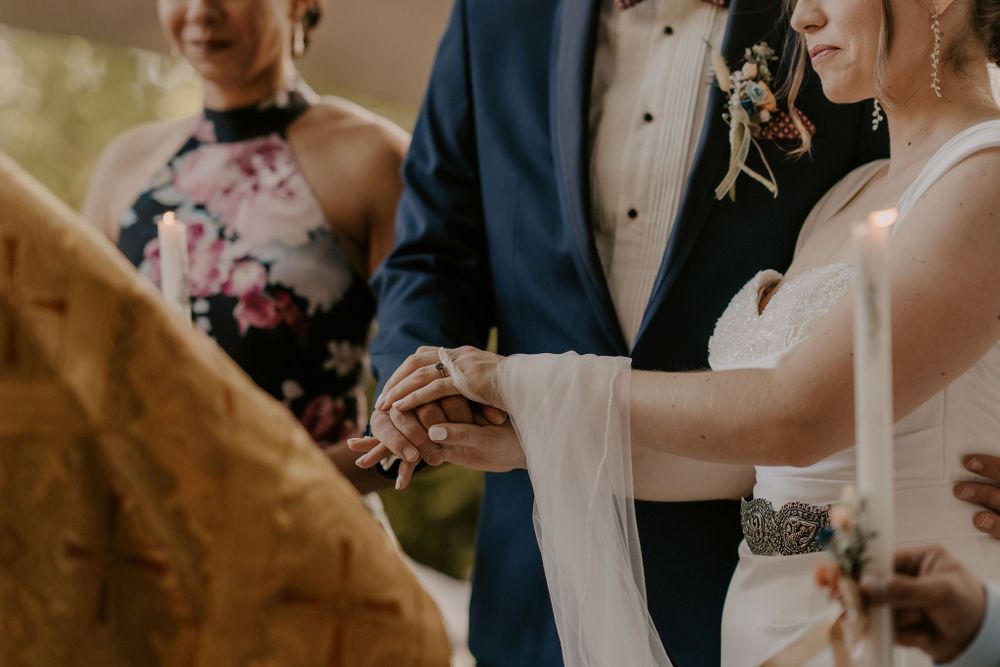 Wedding ceremony guests gathered in formal attire for an intimate celebration.