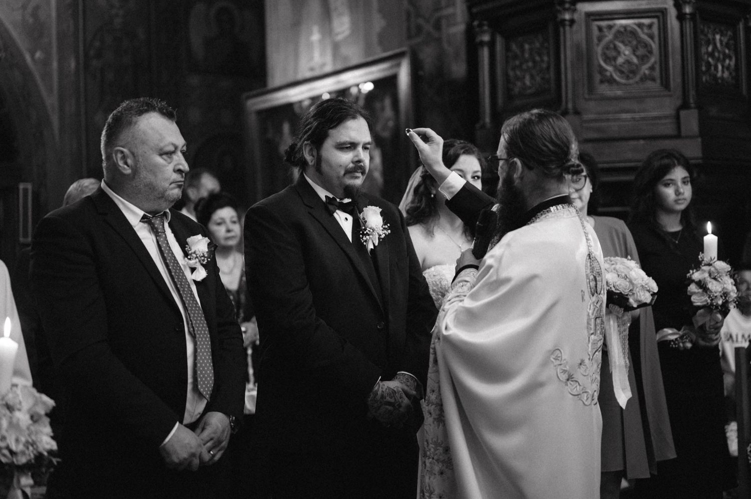 Black and white photo of traditional religious wedding blessing ceremony.