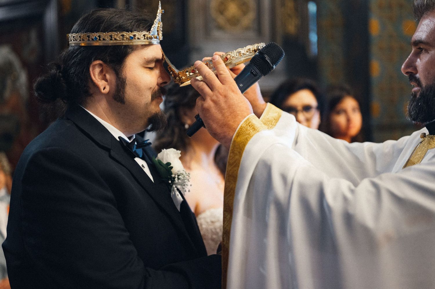 A couple participates in a traditional Orthodox wedding ceremony with a chalice ritual.