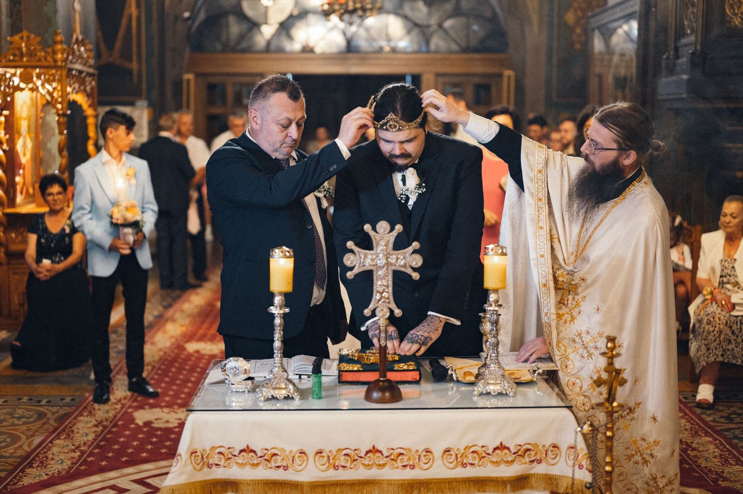 Religious ceremony taking place at an ornate altar with priests performing sacred rituals.
