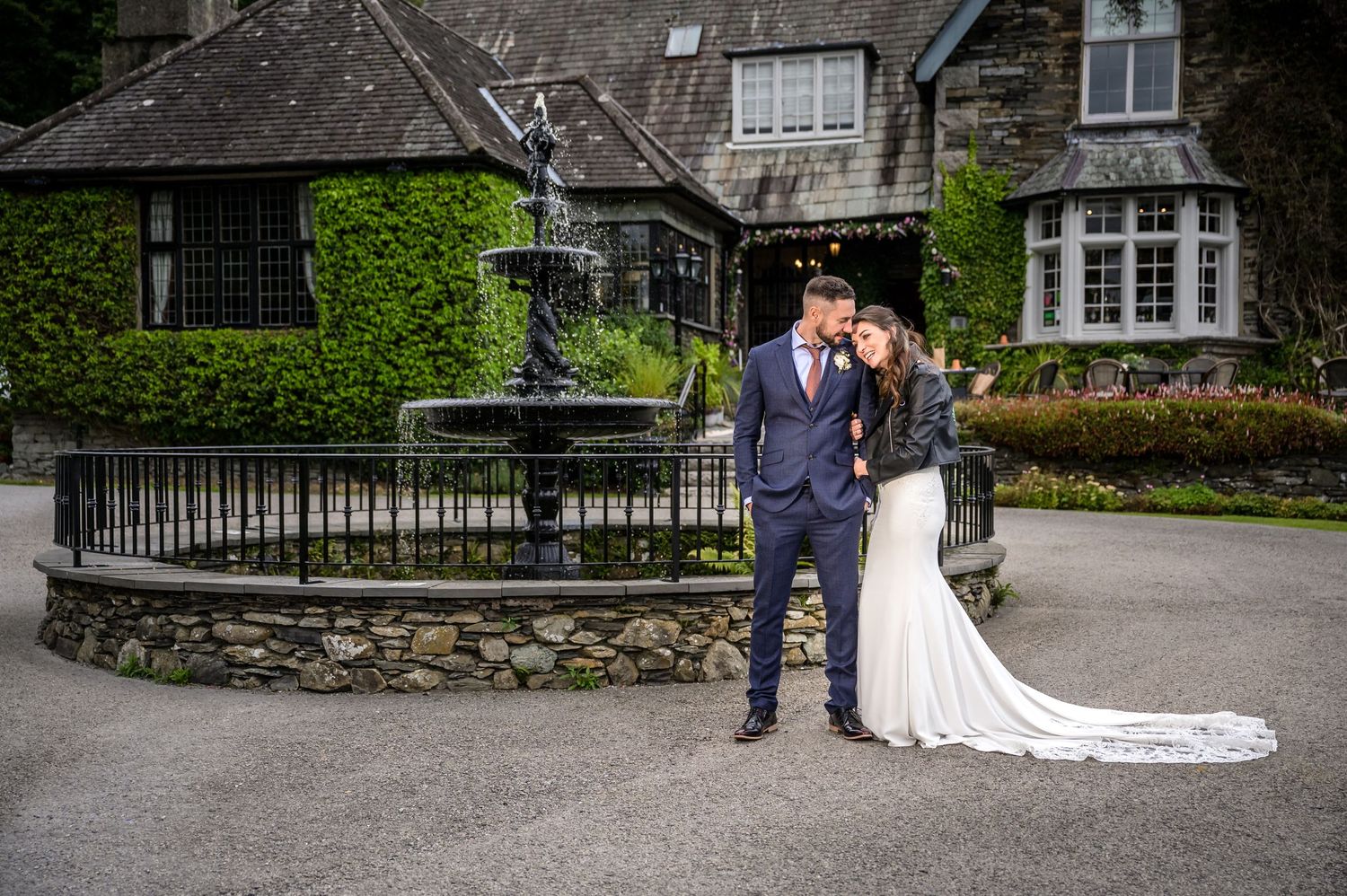 Bride and groom by fountain at Broadoaks Country House Hotel