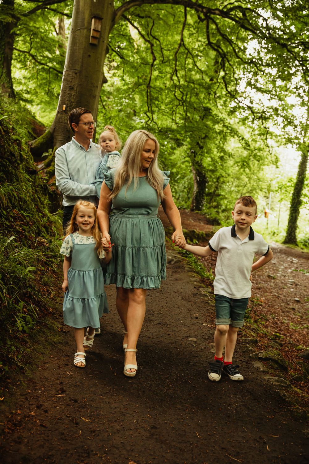 Family walking in woods