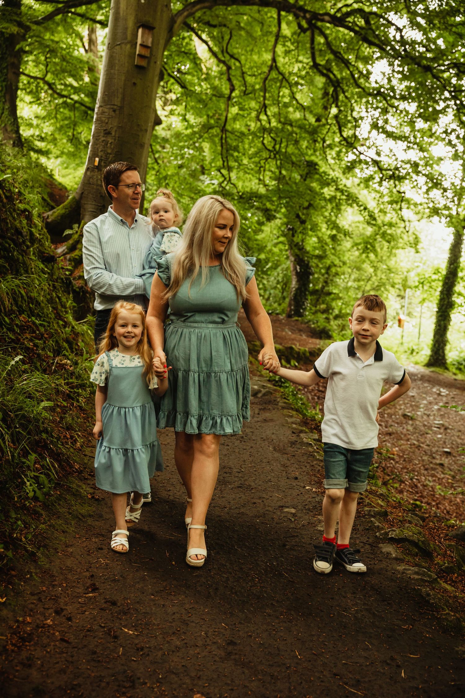 Family walking in woods