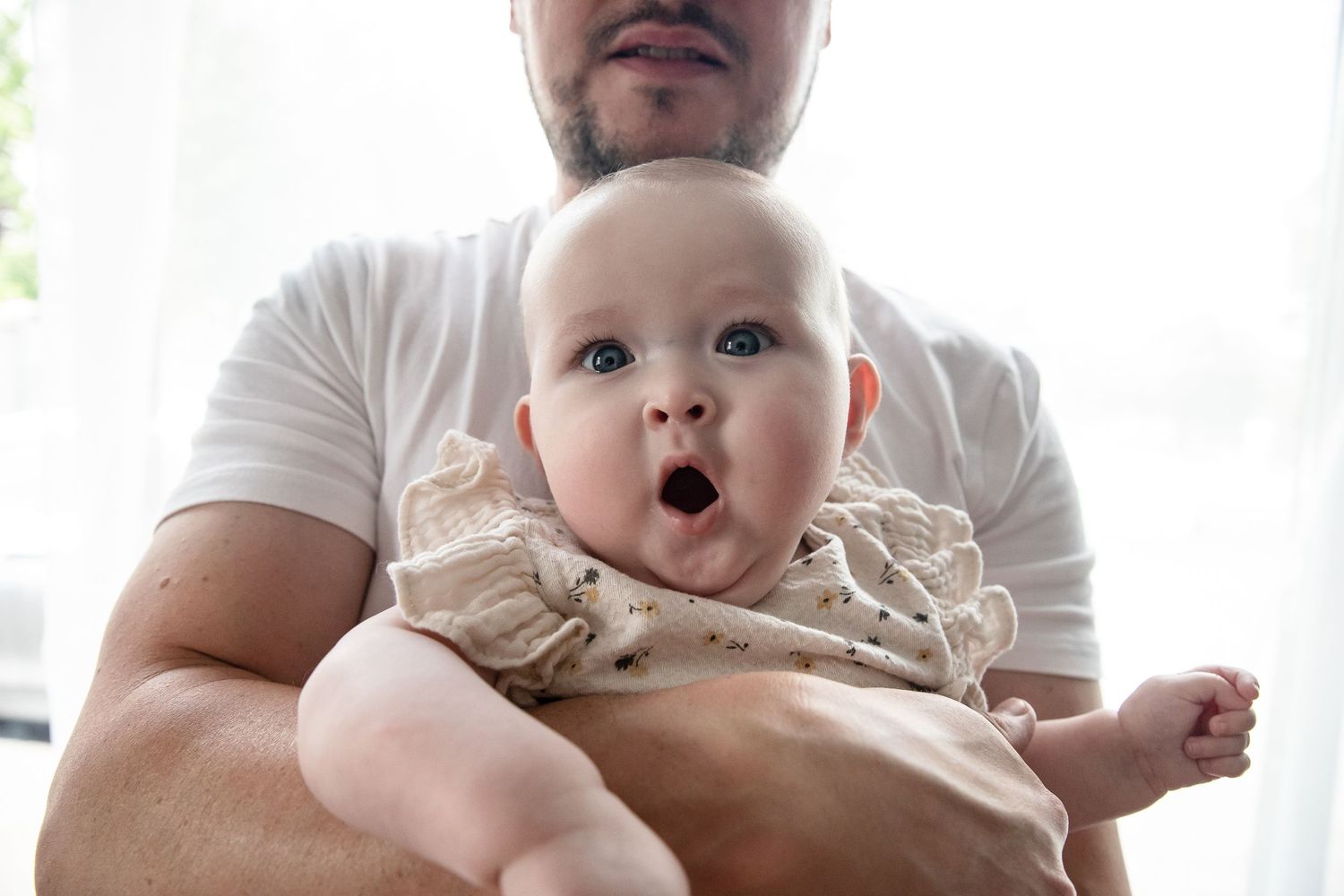 Baby girl makes funny face