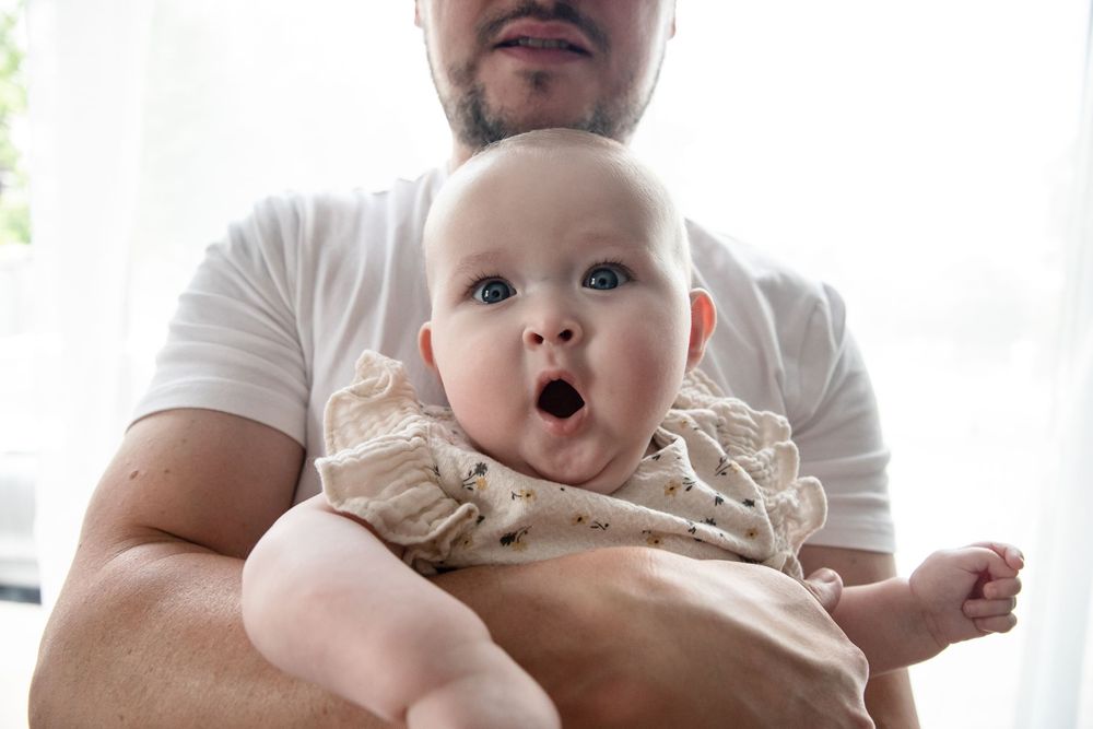 Baby girl makes funny face
