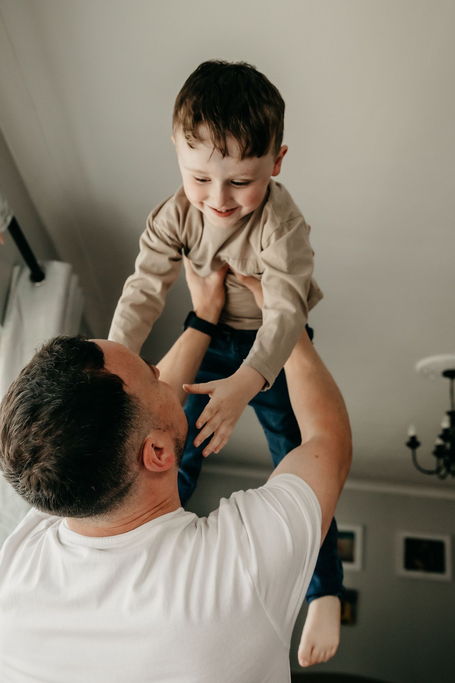 Father throws son in the air