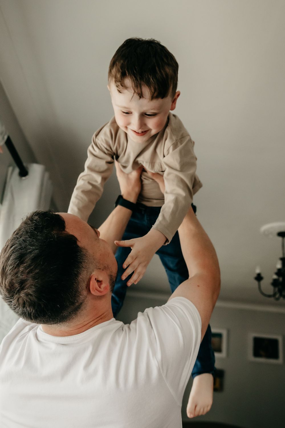 Father throws son in the air