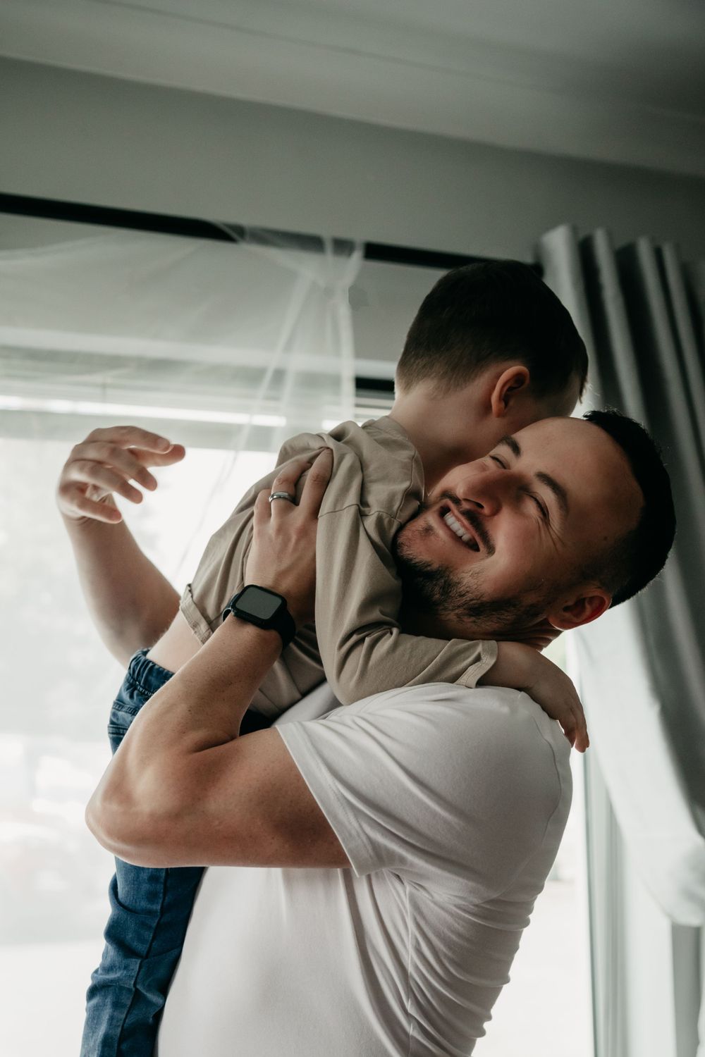 Father and son share a hug