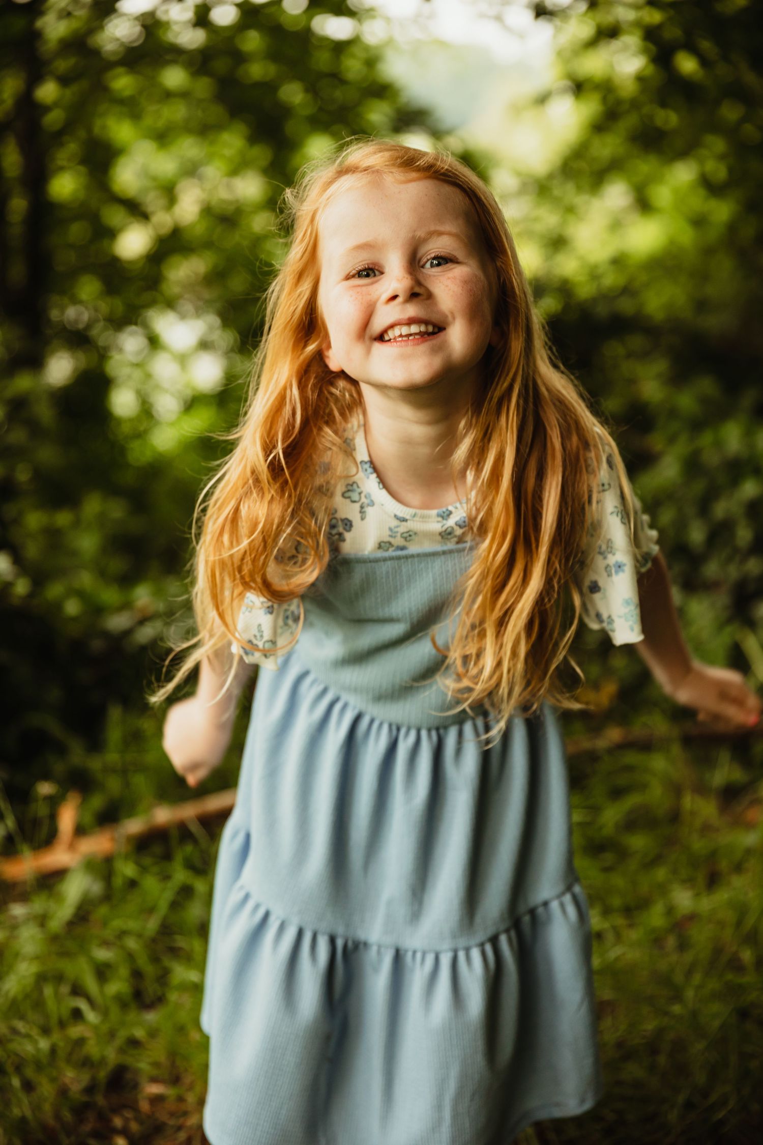 Little girl with red hair smiling