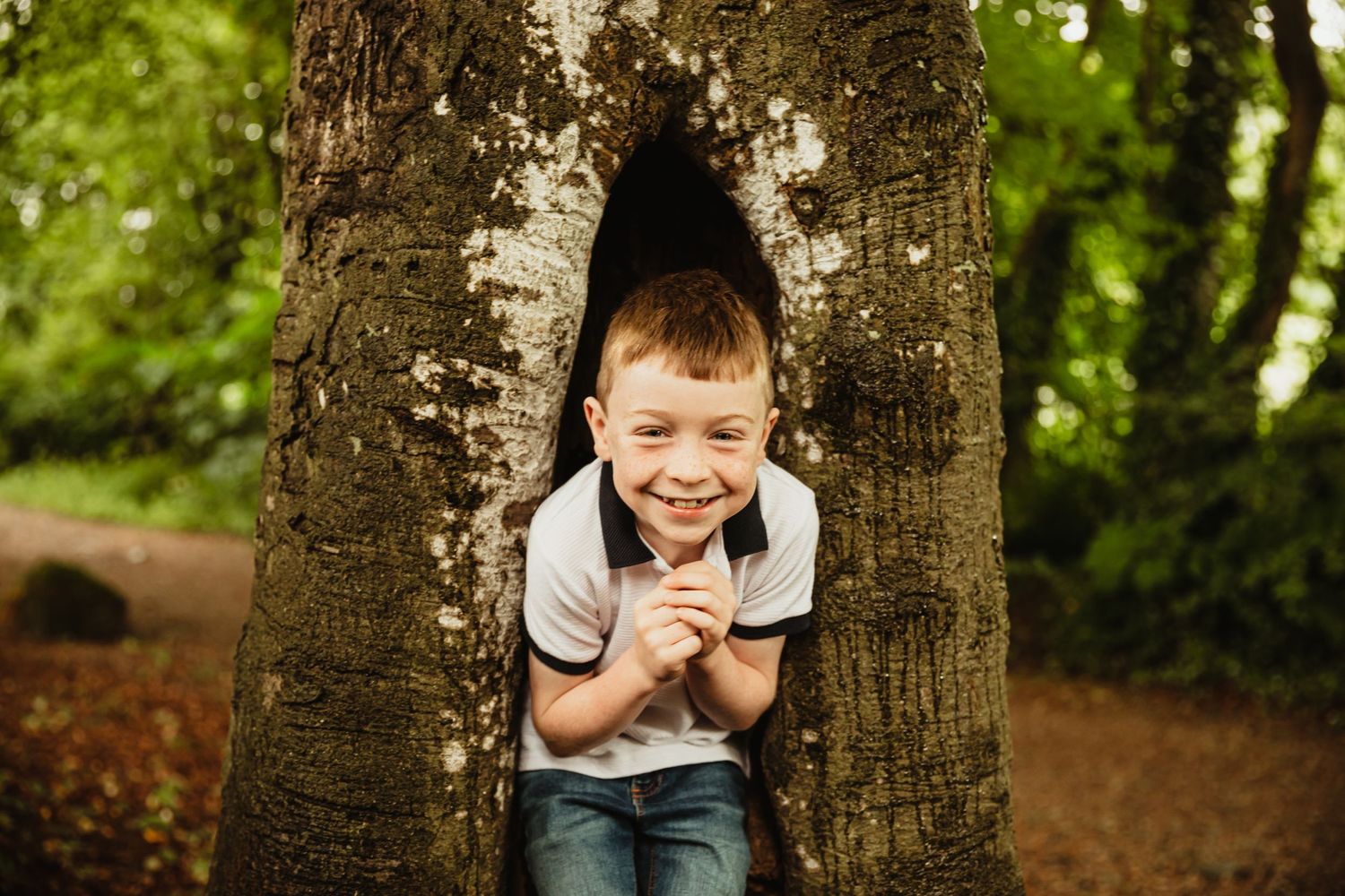 Little boy playing in woods
