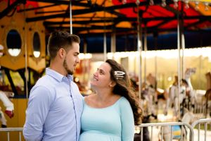 Beautiful couple in front of a merry-go-round