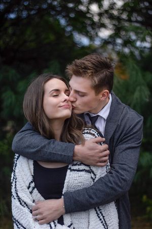Couple hugging during photoshoot