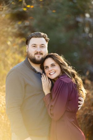 Beautiful couple hugging at golden hour