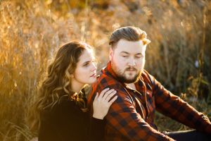 Couple in a field for a Christmas family photoshoot
