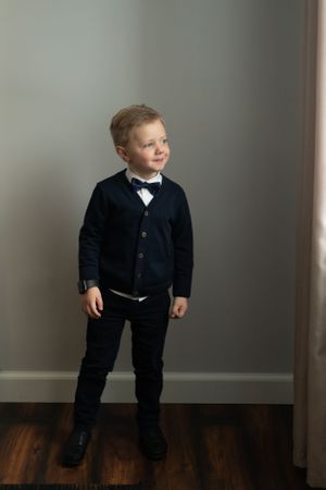 Little boy looking out the window