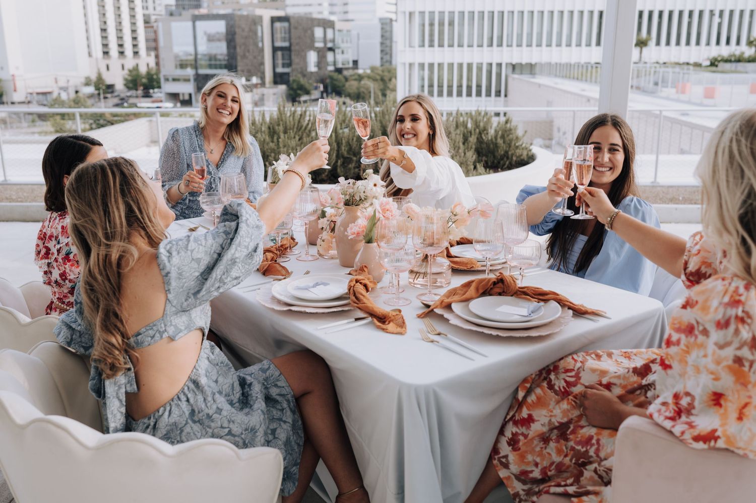 Bridesmaids having brunch on the roof at Post HTX in Houston, Texas.