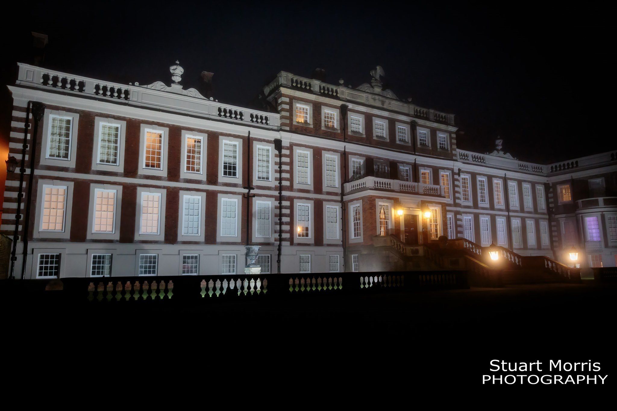 The stunning Knowsley hall lit up at night. Liverpool Wedding photography.. Knowsley hall wedding photographer