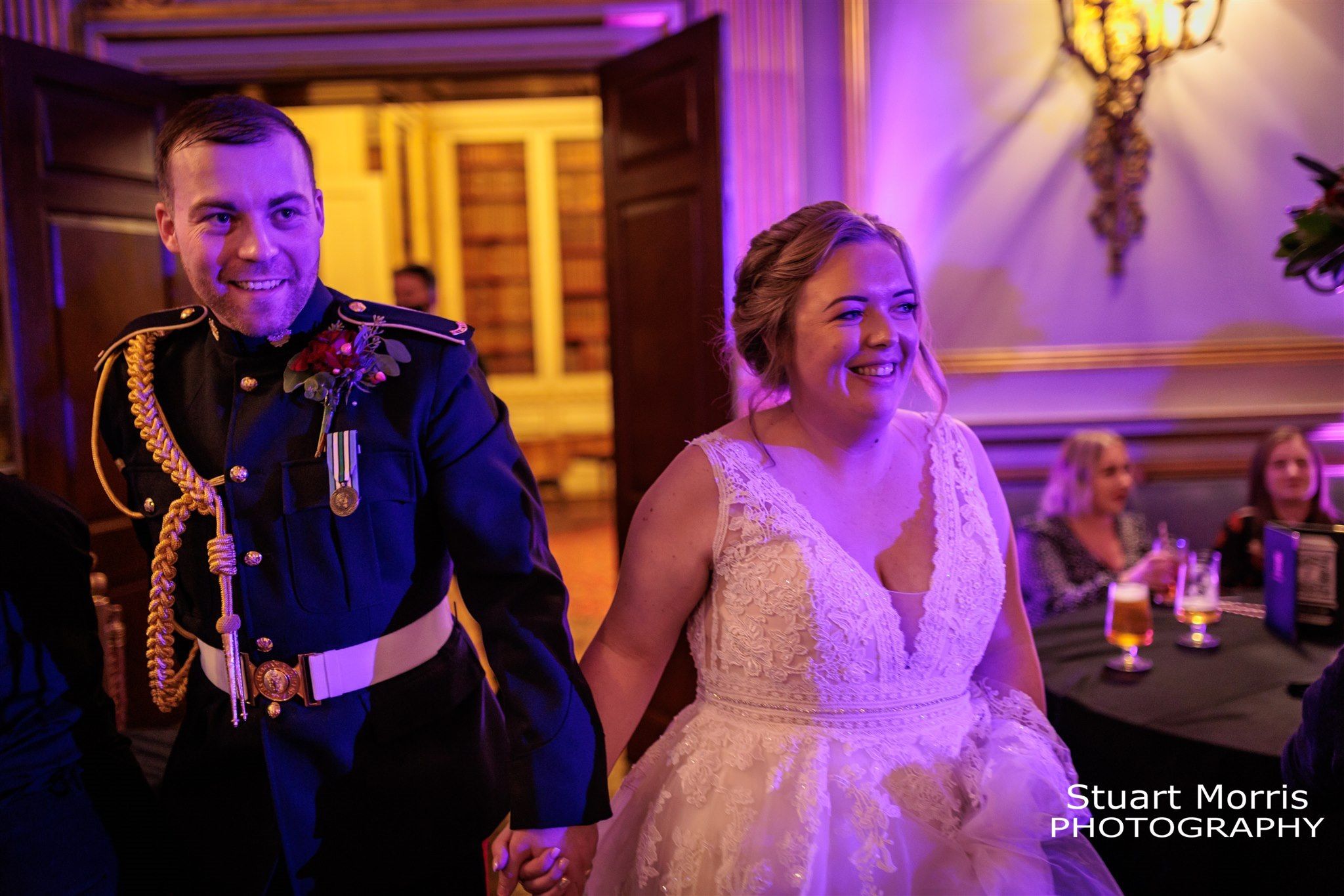 Bride and groom introduced into the room for the wedding reception. Knowsley hall wedding photography.