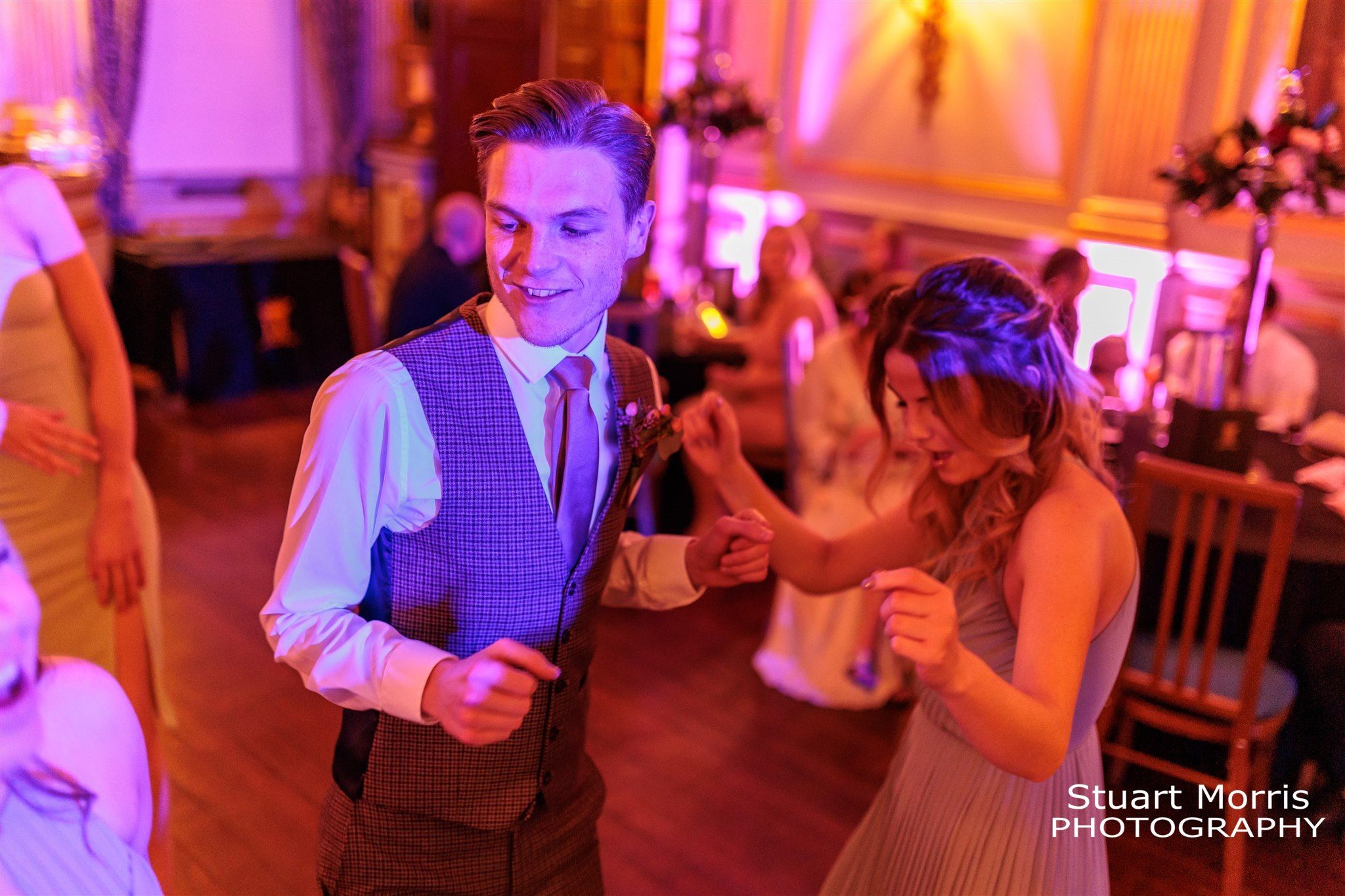 Bridesmaid and the bride’s man of honour dancing at Knowsley hall wedding venue.