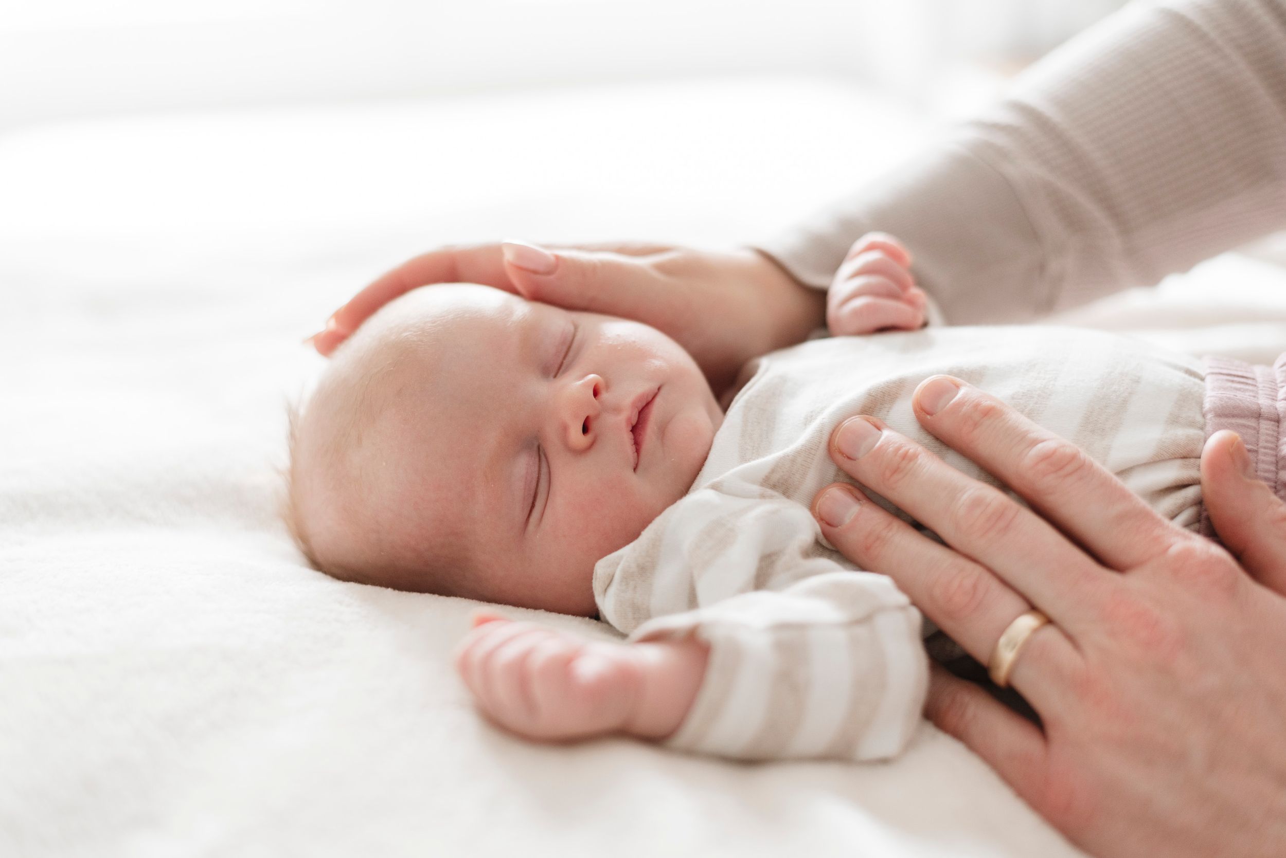 Newborn baby sleeping at in home photoshoot captured by Toronto Newborn Photographer Jess GC Photography