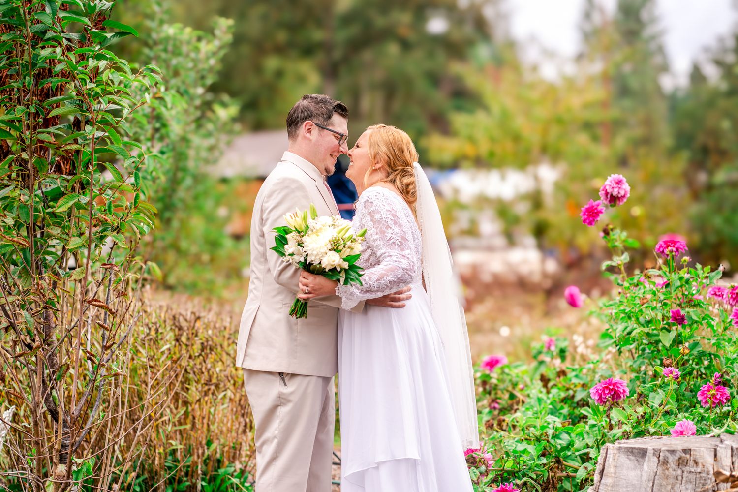 bride and groom laugh together