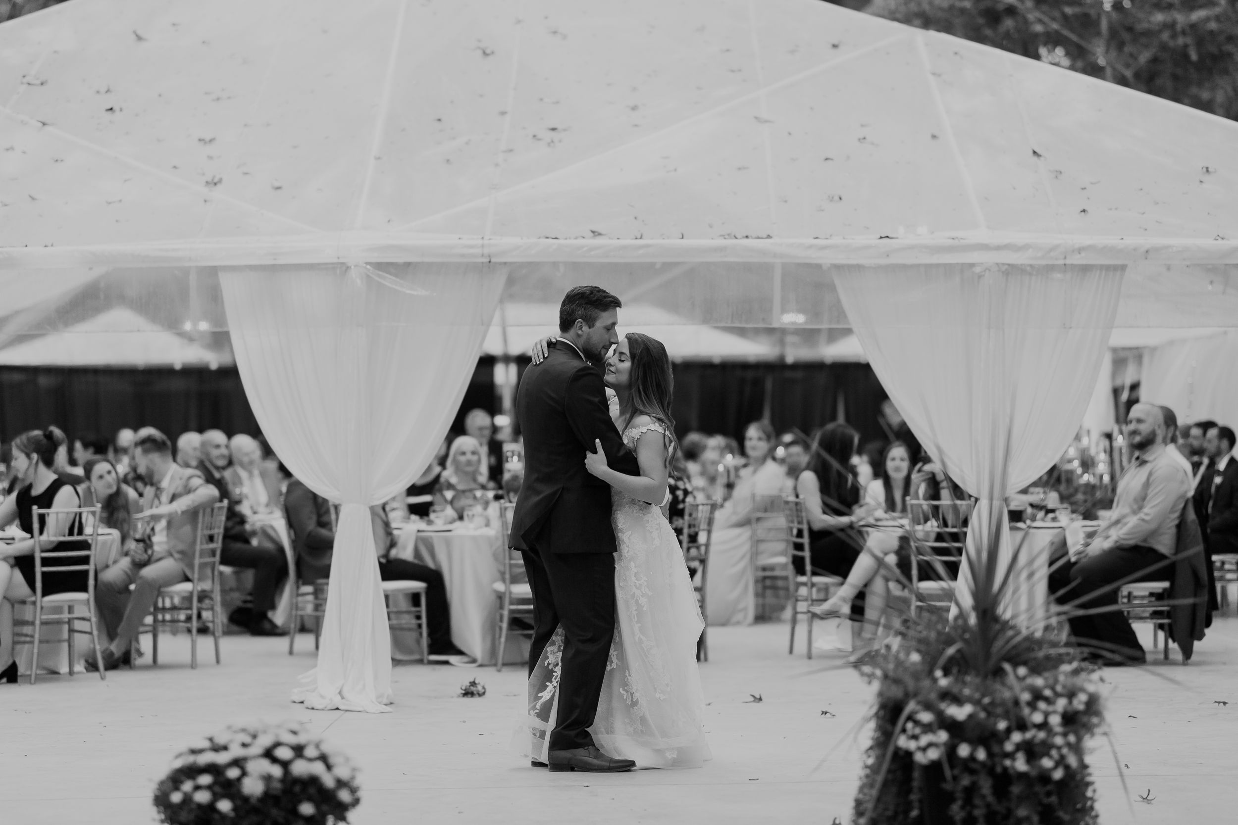 bride and groom dancing their first dance at wedding in the woods wedding venue