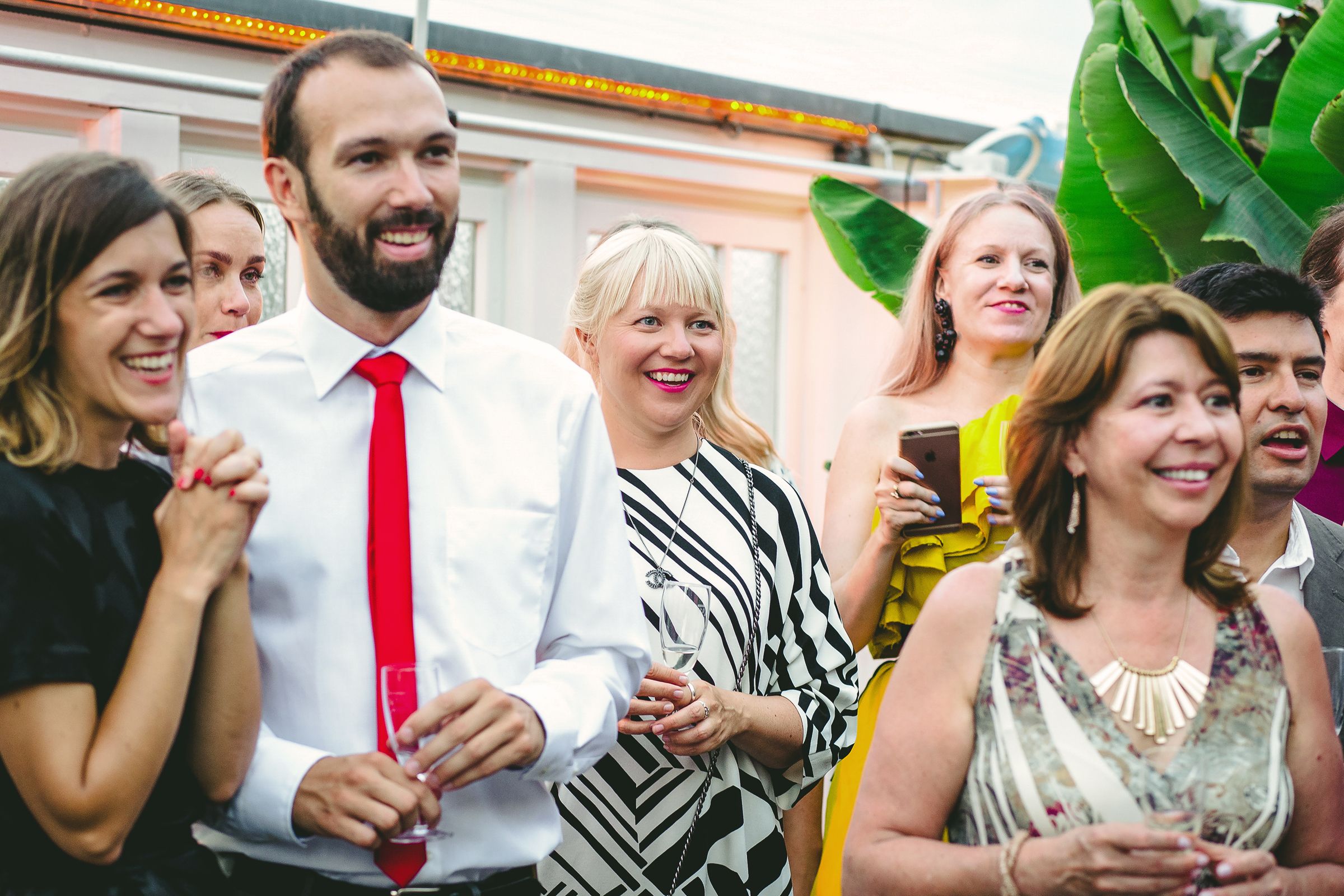 A diverse group of people, participating in a friendly happy gathering.
