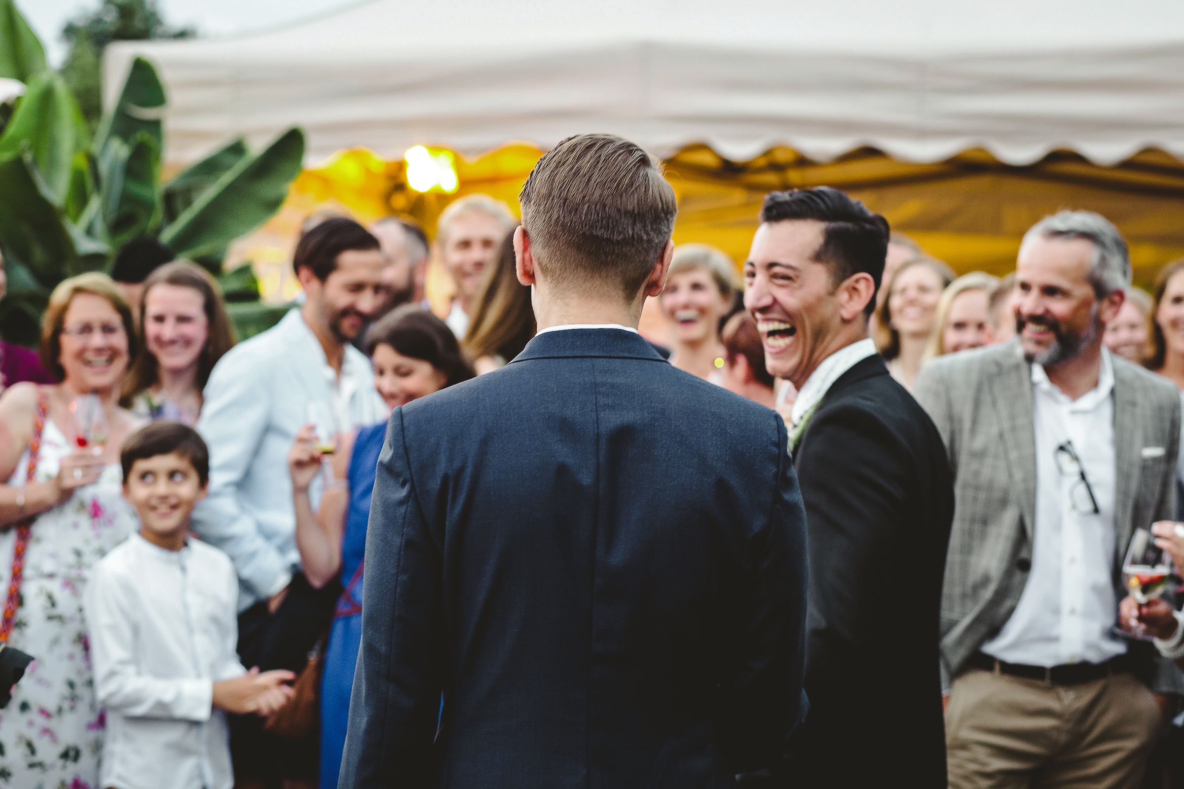 A man stand before a captivated crowd, embodying a moment of engagement and interaction with the audience.