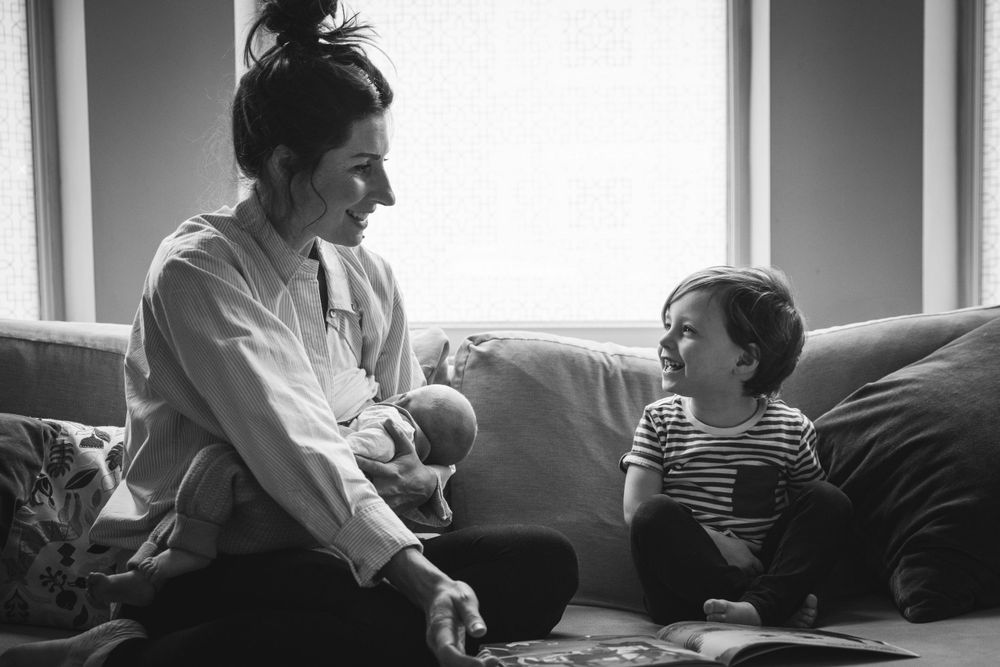 A family shares a relaxed moment together on a comfortable couch.