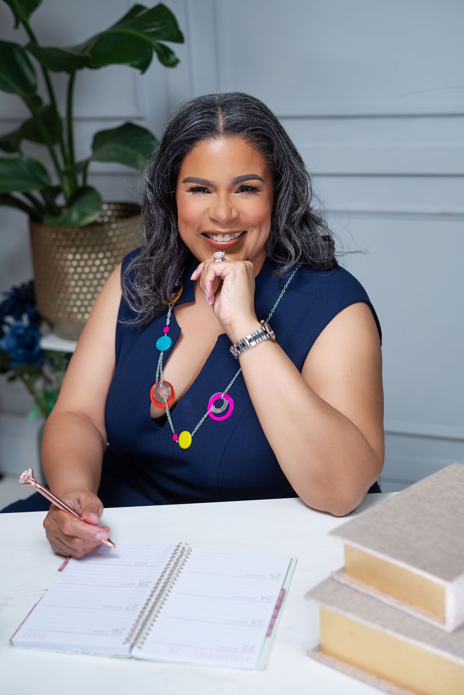 Branding photo of a female entrepreneur with her product line in Columbia, SC