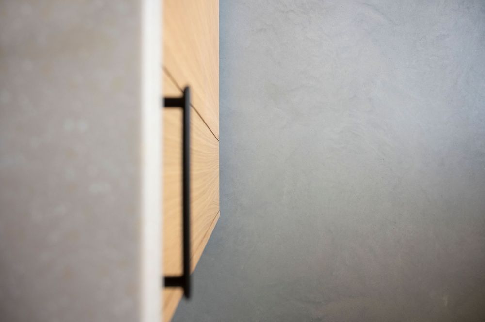 Abstract architectural detail showing white wall corner and shadow patterns.