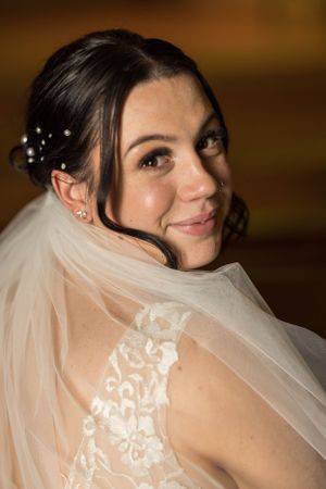 bride looking over her shoulder in chapel