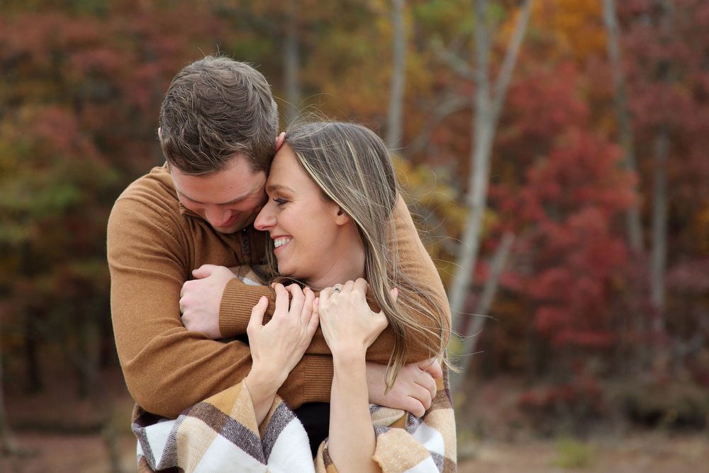 Couple embracing during Ohio Fall photo shoot.