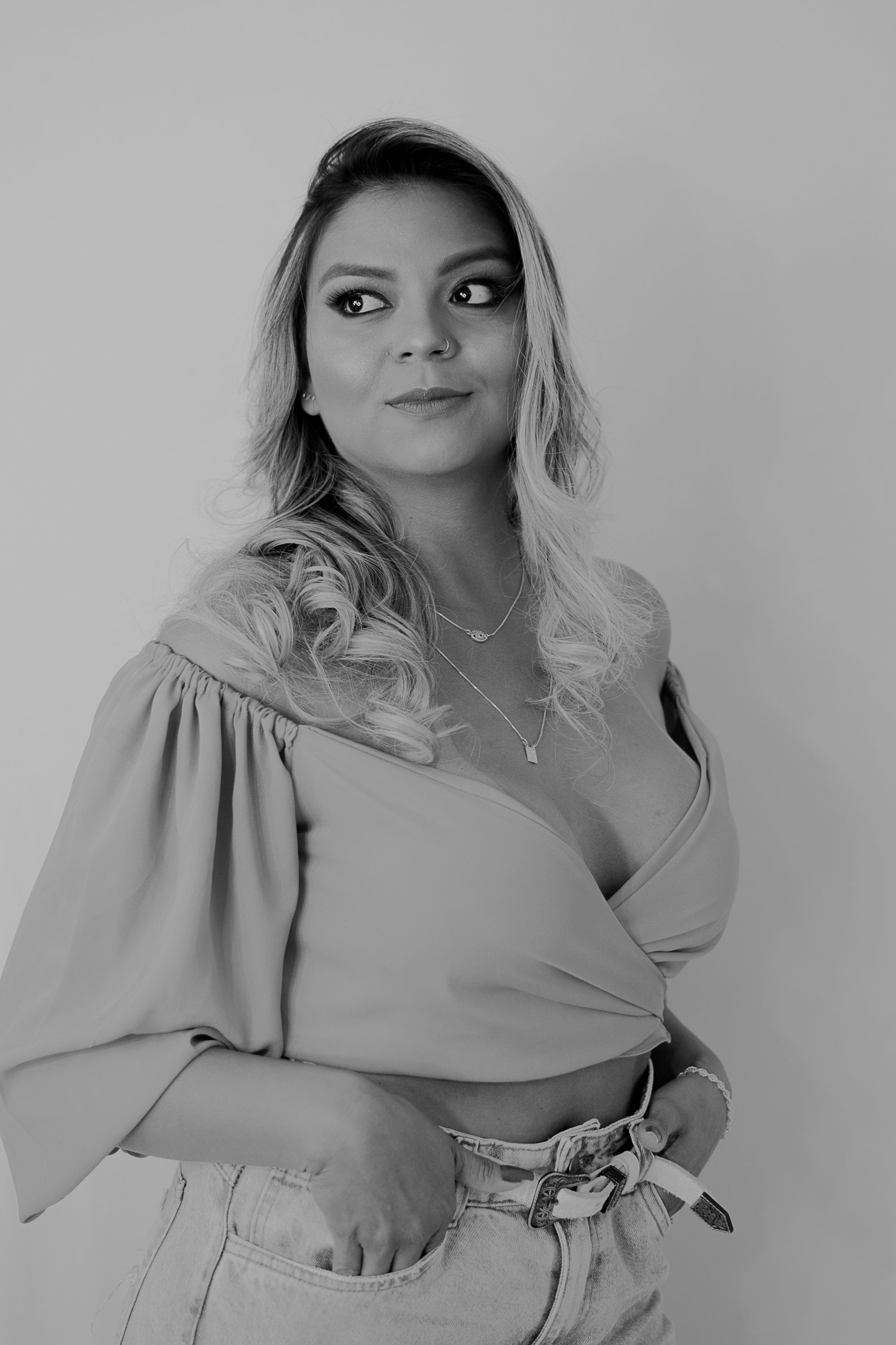 Fashion portrait series in grey monochrome featuring an off-shoulder top.