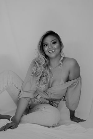 Artistic boudoir photos in neutral tones with soft lighting.