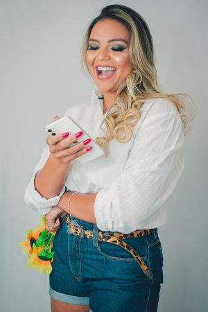 Candid shots showing animated expressions while using mobile phone.