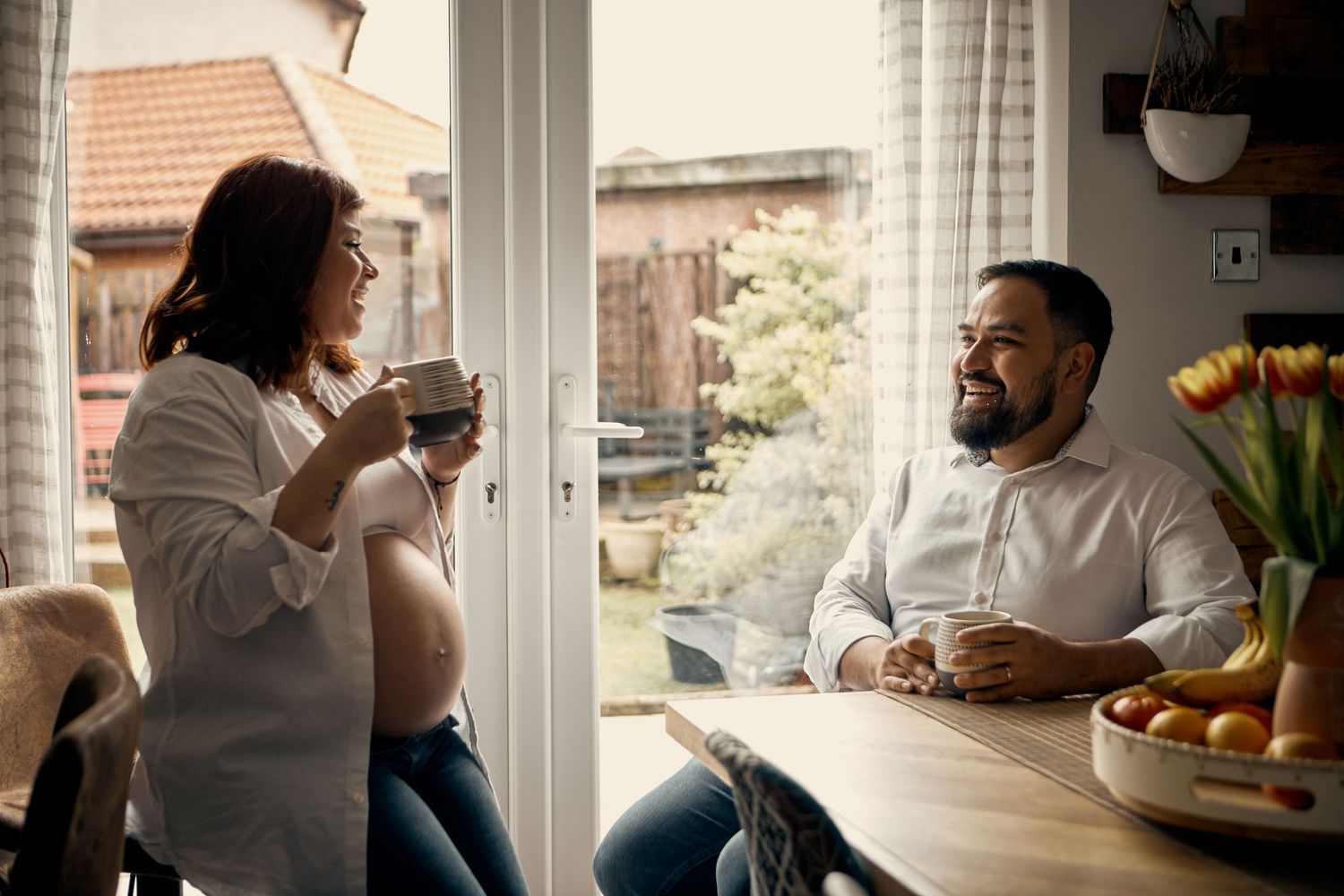 pregnant woman with partner at home