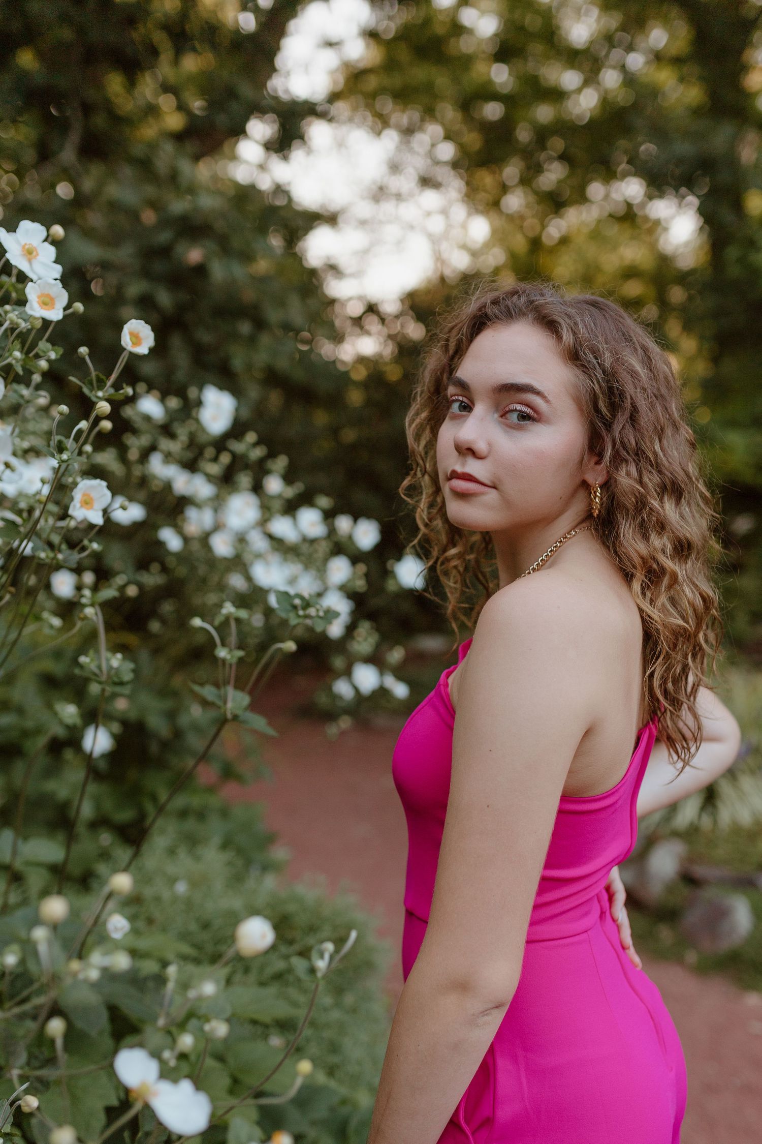 Connecticut senior poses at Elizabeth Park for graduation photoshoot