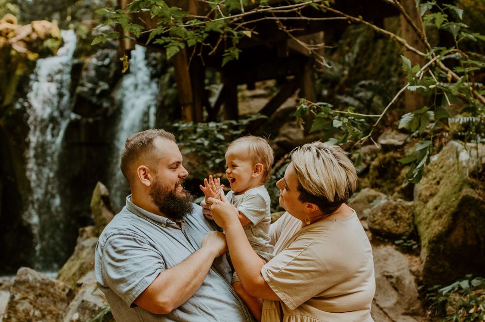 Sweet family interaction during an outdoor adventure in the woods.