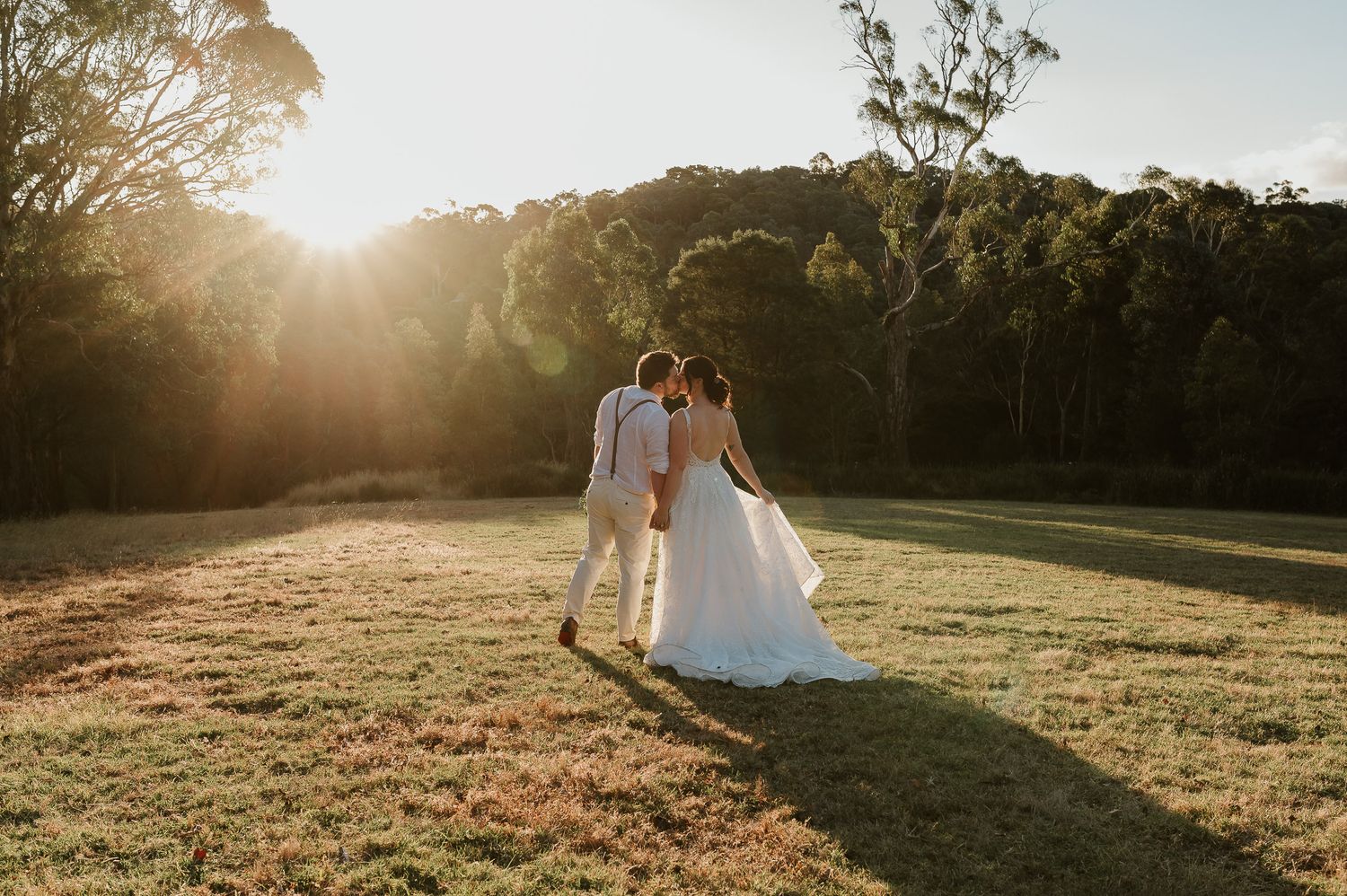 romantic image of bride and groom during sunset by tasmanian elopement and wedding photographer joss jensen