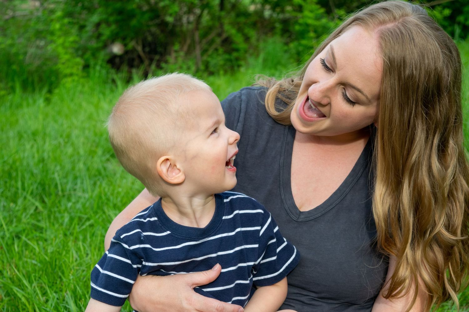 Mother and son during Family portrait session. Lenexa, KS. Craig Crossing Park.