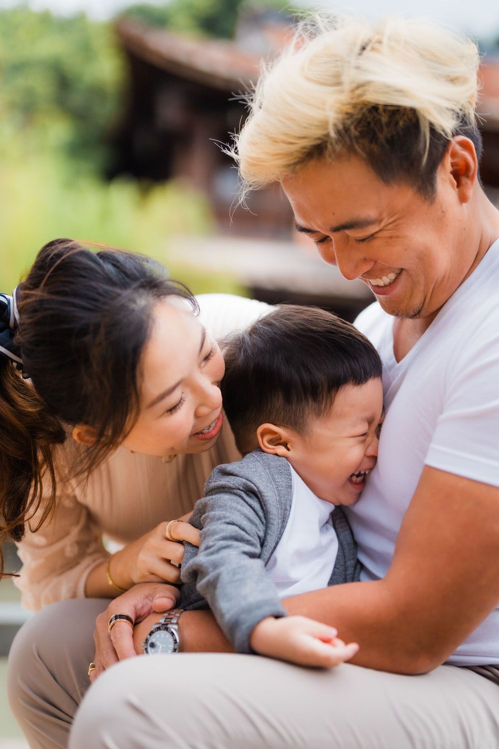 Happy family sharing a joyful moment together outdoors.