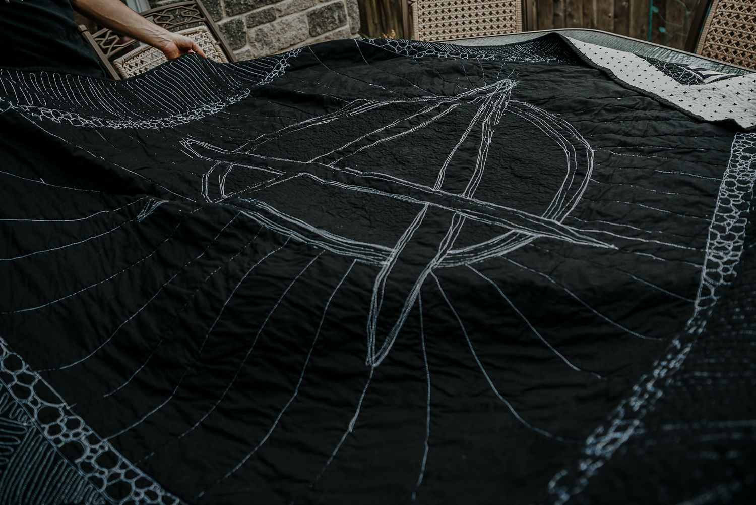 Custom anarchy stitching on the back of a punk t-shirt memory quilt.