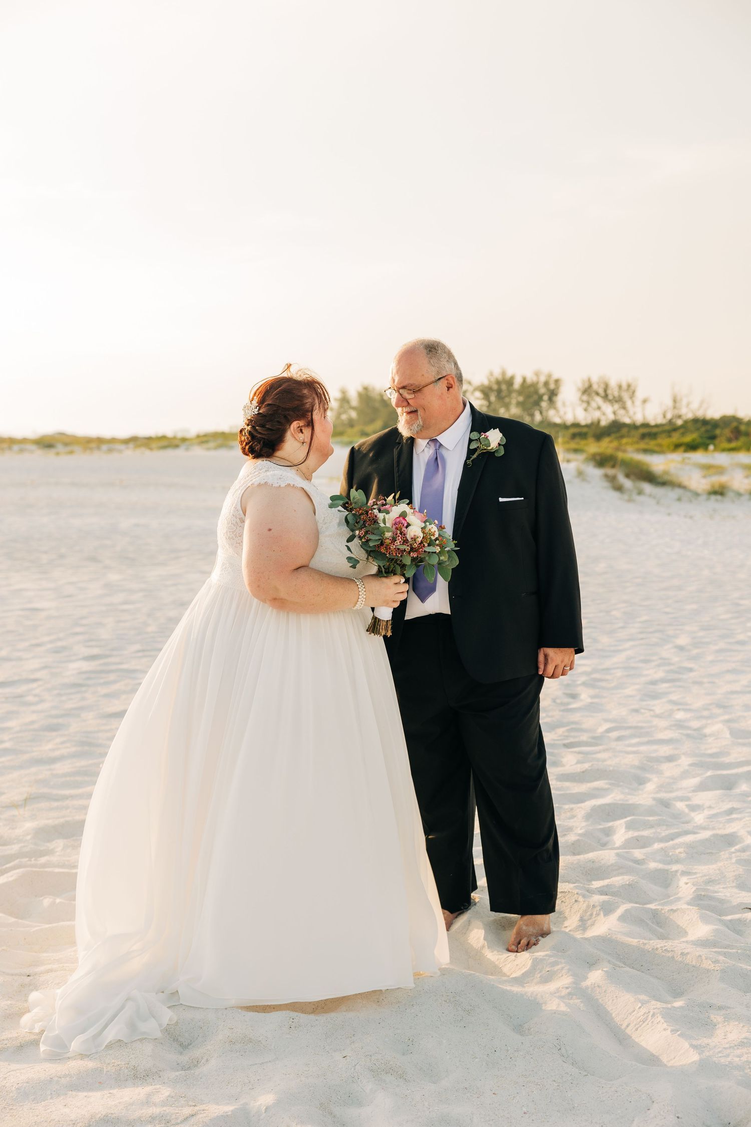 Bridal portraits at sunset on Siesta Key Beach. Photographed by Sarasota wedding photographer Samantha Brown Artistry.