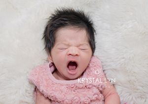 Biggest yawn for this little girl in a dress her Mommy picked out
