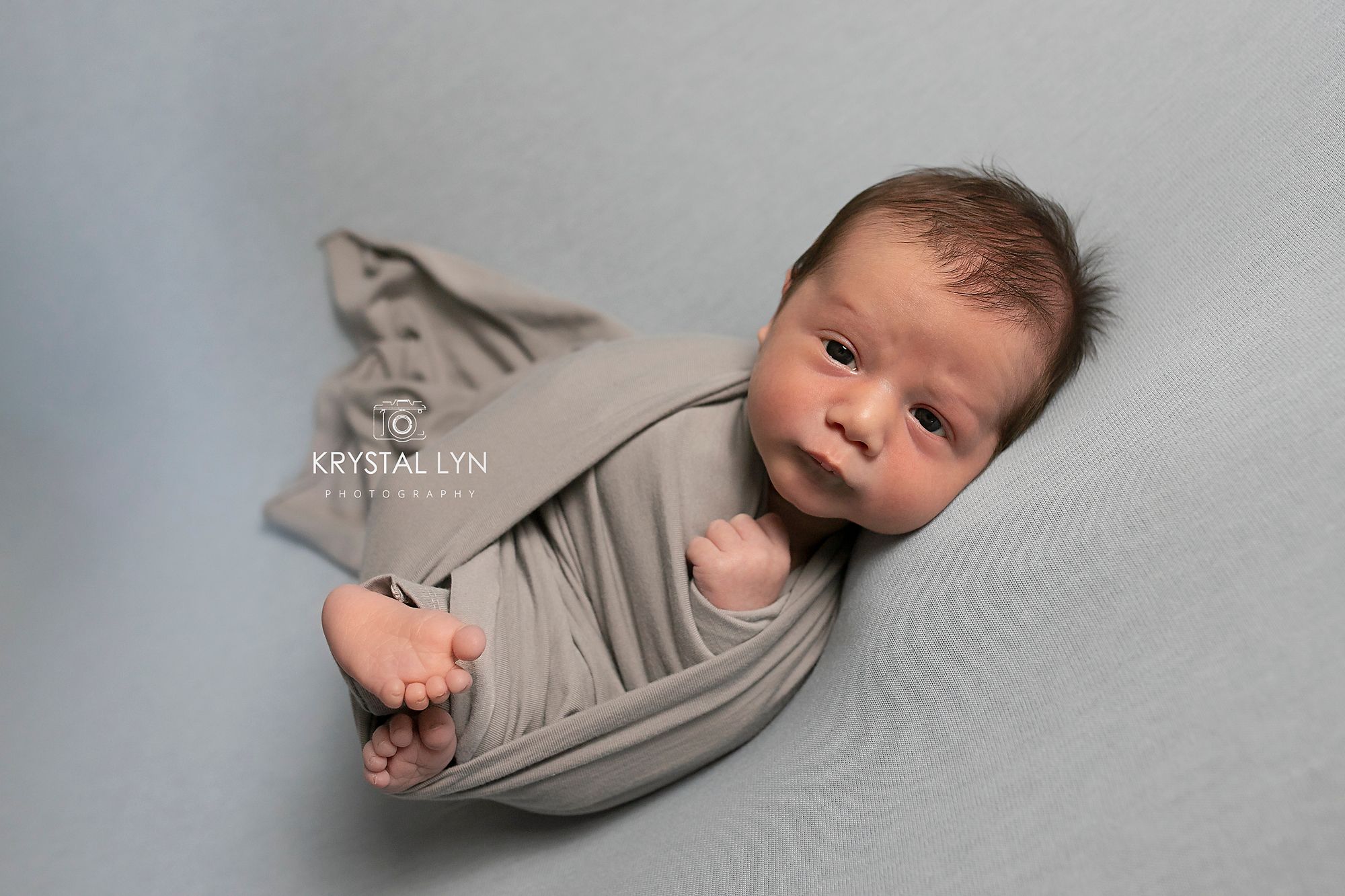 baby so alert in blue and grey with brown hair