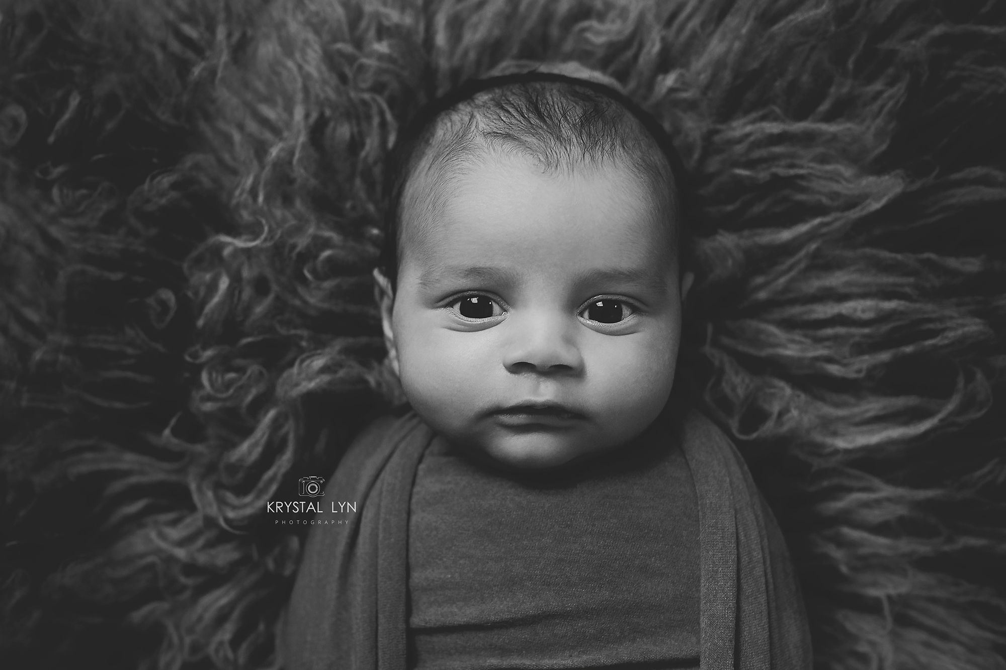 Beautiful black and white photo of babies wide open eyes